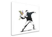 a black and white picture of a man holding a bouquet of flowers