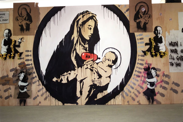 a mural of a woman holding a baby