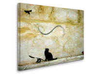 a painting of a cat and a bird on a wall
