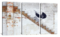 a painting of a bird on a brick wall