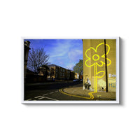 a yellow flower painted on the side of a building