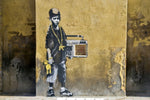 a painting of a man with a boombox on the side of a building