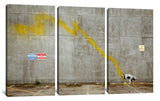 a cow standing in a parking lot next to a wall