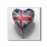 a heart shaped balloon with a cross on it