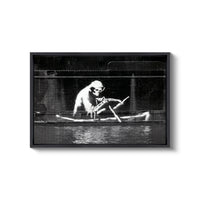a black and white photo of a man in a boat