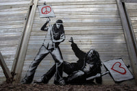 a mural of a man holding a protest sign