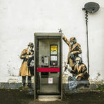 a phone booth with a painting of soldiers on it