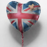a heart shaped balloon with a cross on it