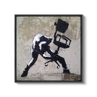 a black and white picture of a man sitting on a chair