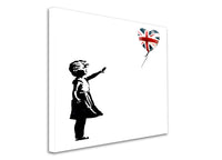 a black and white picture of a little girl flying a kite