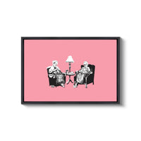 a couple of people sitting in chairs next to a lamp