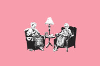 a couple of people sitting in chairs next to a lamp