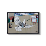 a picture of a bird painted on the side of a building