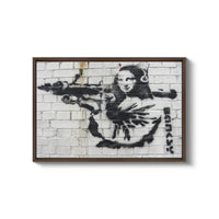 a painting of a woman with a gun on a brick wall