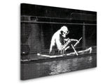 a black and white photo of a man in a boat