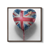 a heart shaped balloon with a cross on it