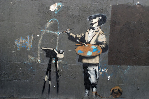 a painting of a man with a guitar on a wall
