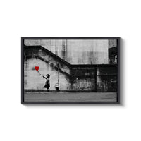 a black and white photo of a person holding a heart balloon