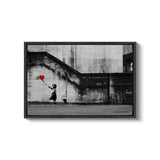 a black and white photo of a person holding a heart balloon