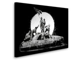 a black and white photo of a group of people standing on top of a car