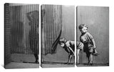 a black and white photo of two children standing in front of a wall