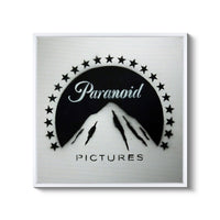a black and white picture of a mountain with stars