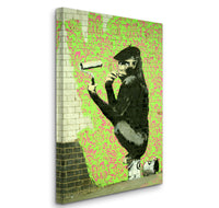 a painting of a monkey on a brick wall