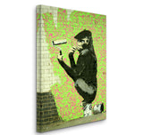 a painting of a monkey on a brick wall