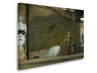 a man spray painting a wall with horses on it