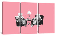 a couple of people sitting next to each other on a pink wall