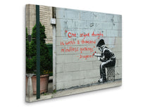 a man sitting on a chair in front of a wall