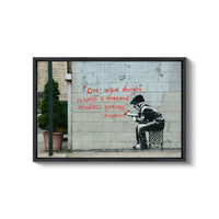 a man sitting on a chair in front of a wall