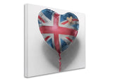 a heart shaped balloon with the british flag painted on it