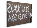 a man standing next to a wall with graffiti on it